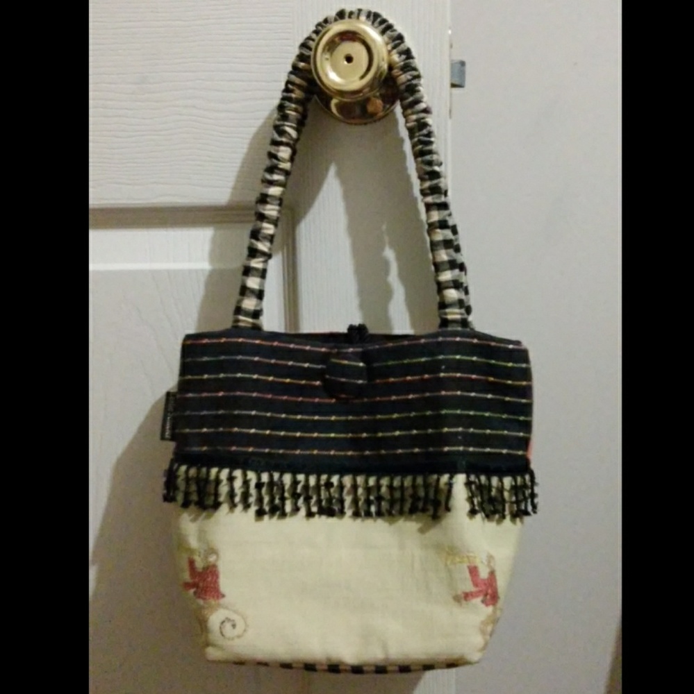 Unique trumpeting monkey print handbag